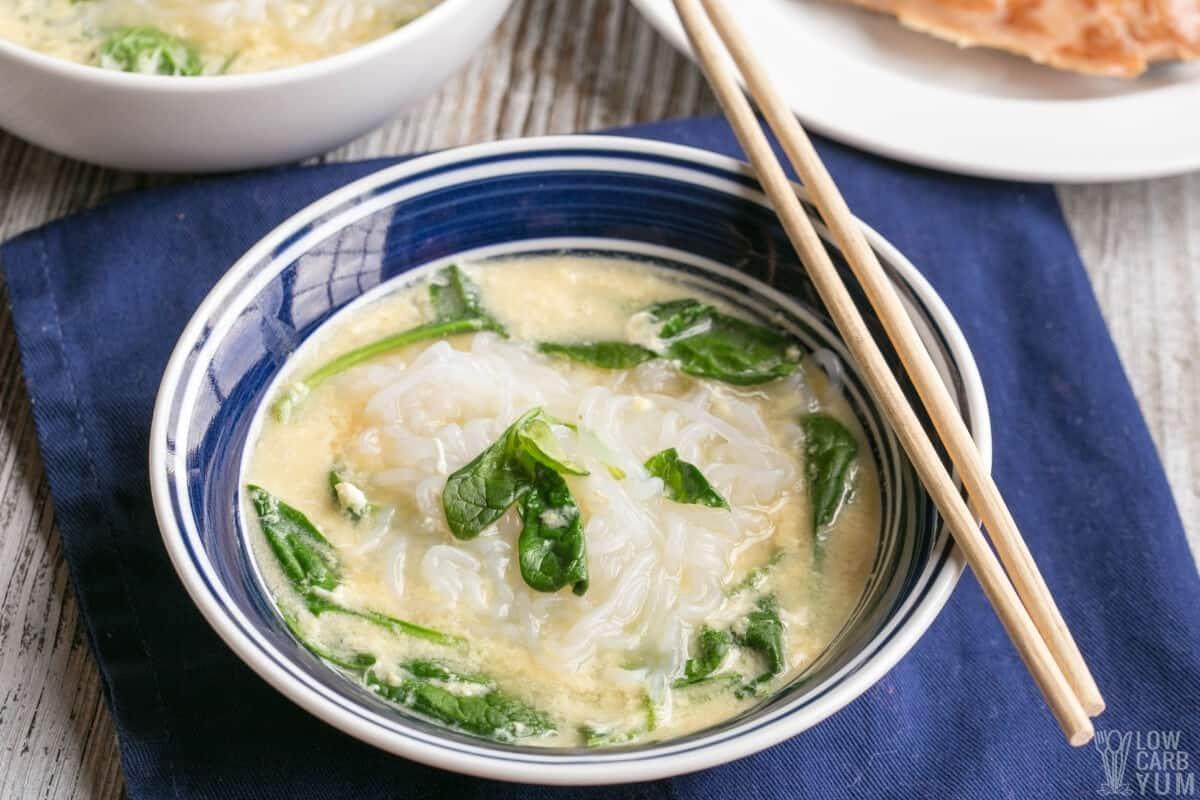 Person enjoying a bowl of Keto Shirataki Noodle Soup