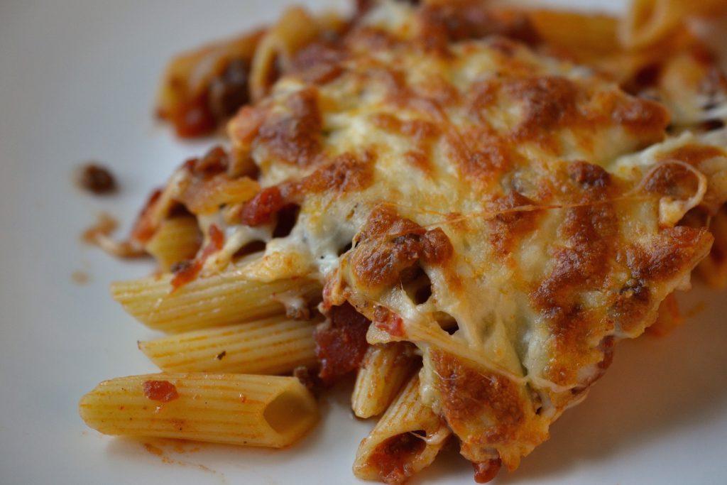 close up of camel meat lasagna in a baking dish
