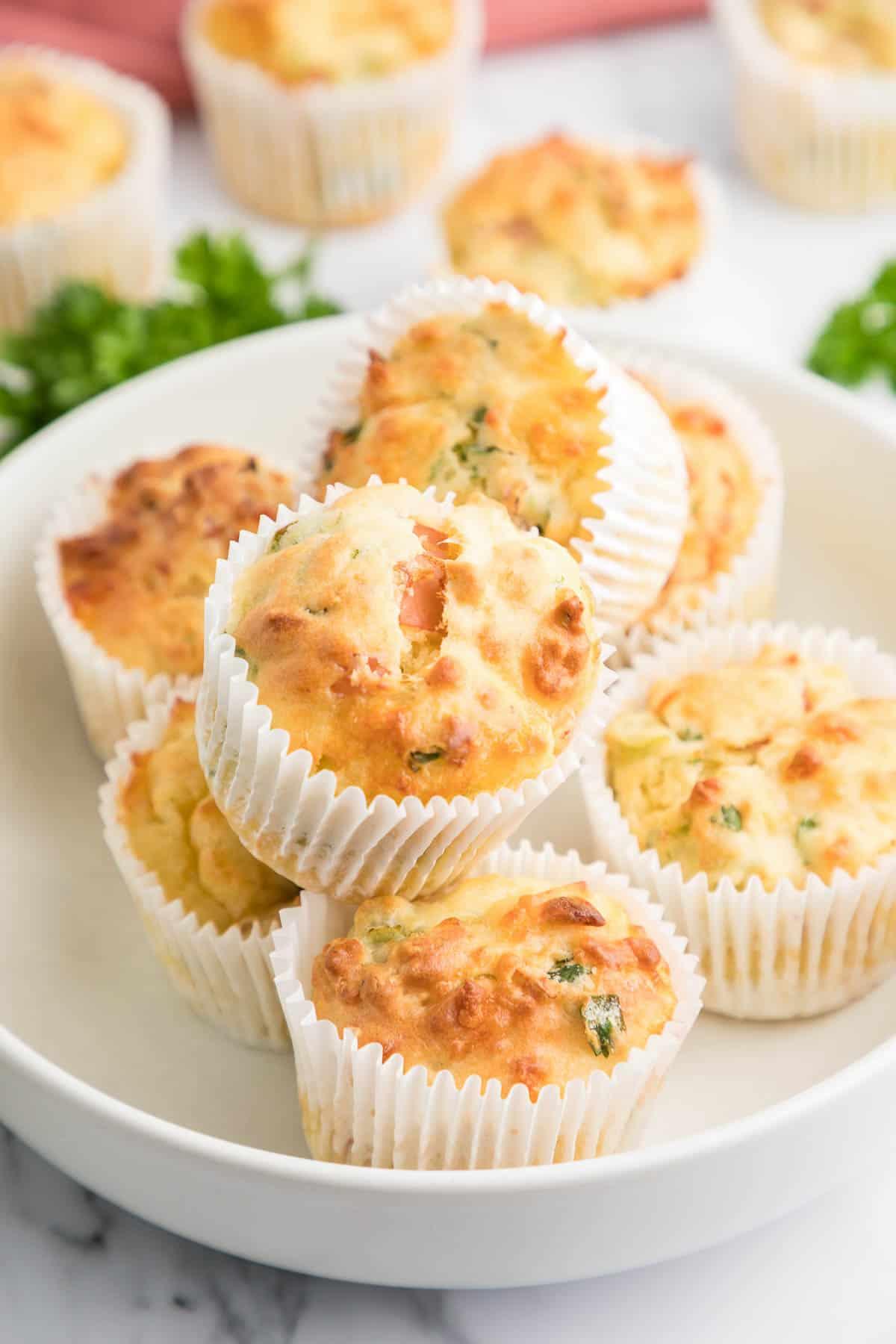savory ham and cheese muffins displayed on a platter