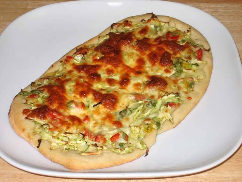 Delicious homemade pizza with sautéed cabbage topping