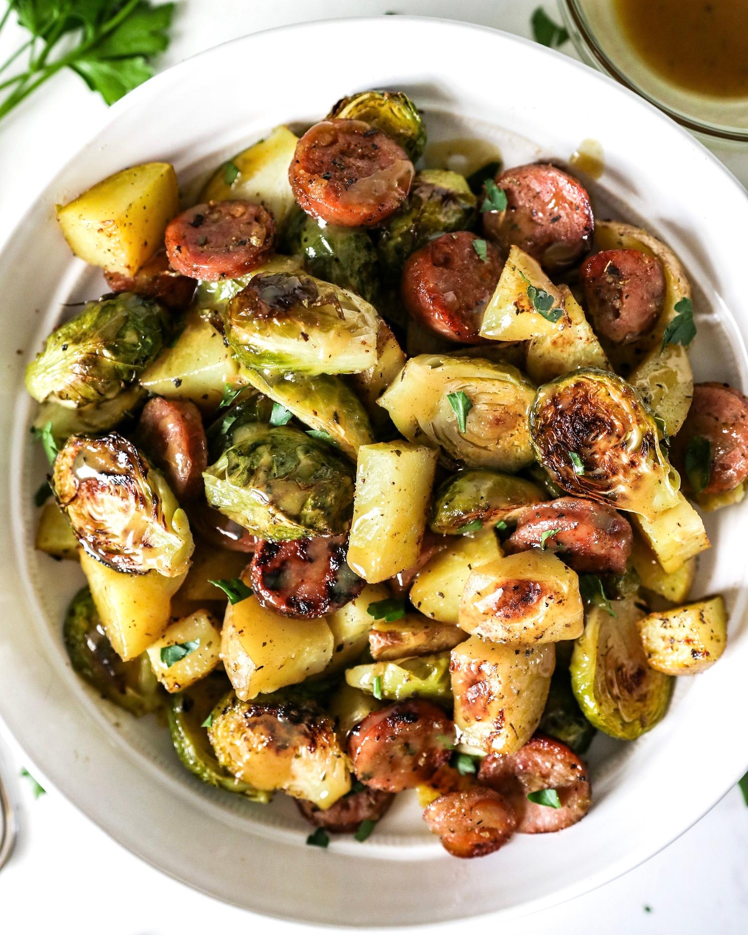 a slice of brussel sprout and sausage casserole being served