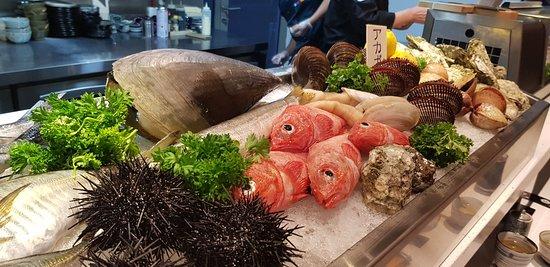 Fresh flying fish displayed at a Japanese fish market