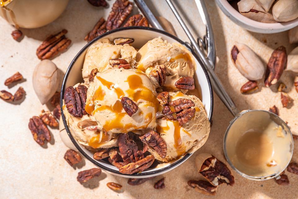 scoop of pecan pie ice cream with caramel drizzle