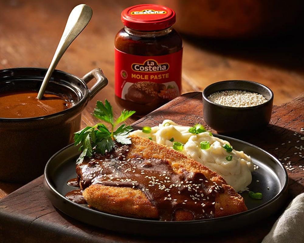 fried chicken covered in mole poblano sauce