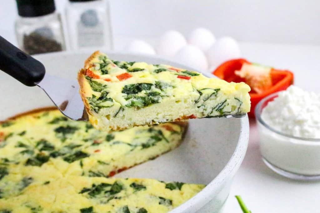 close up of a slice of frittata being served