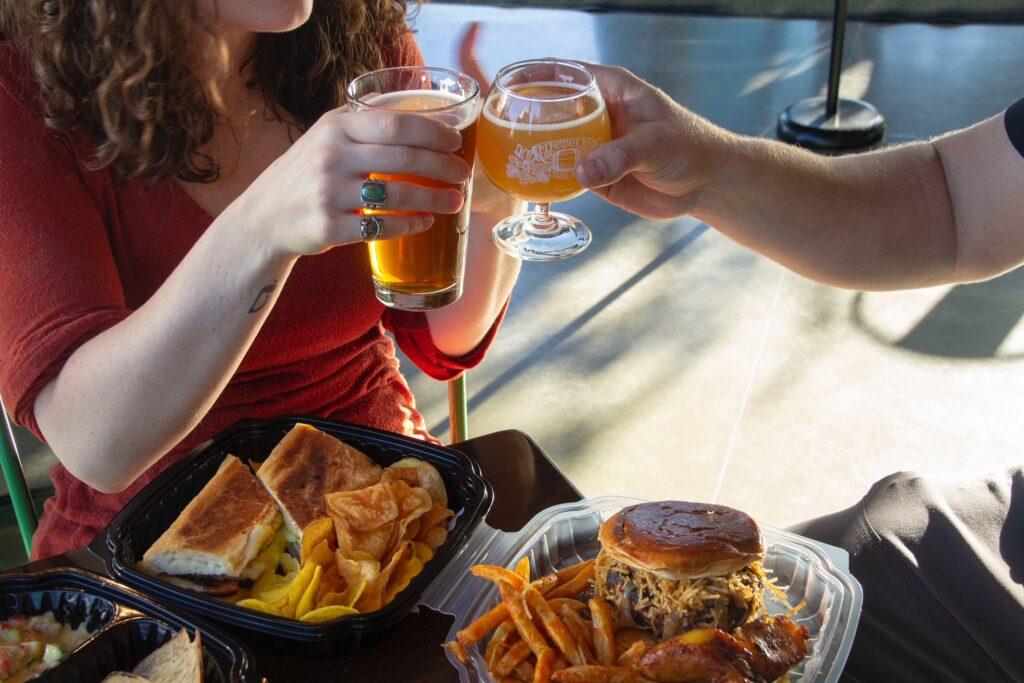 A person enjoying different beer and food pairings