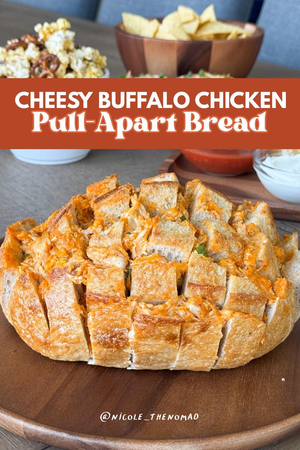Overhead shot of buffalo chicken tear-away bread in a baking dish, golden and cheesy