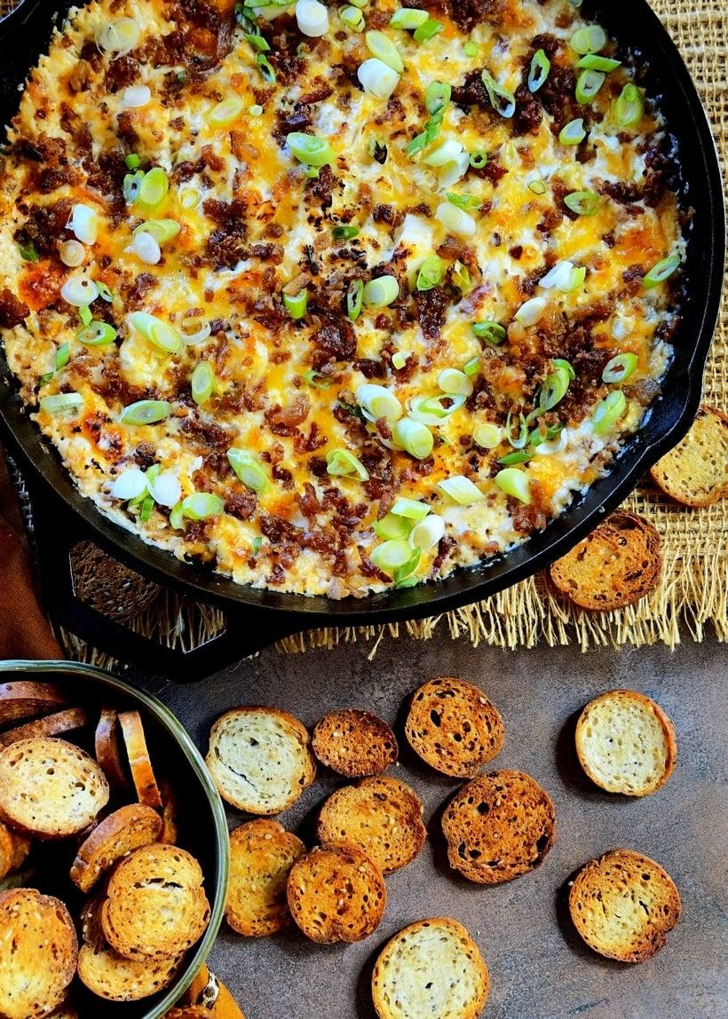 Ingredients for cashew cheese bacon ranch dip laid out on a wooden table