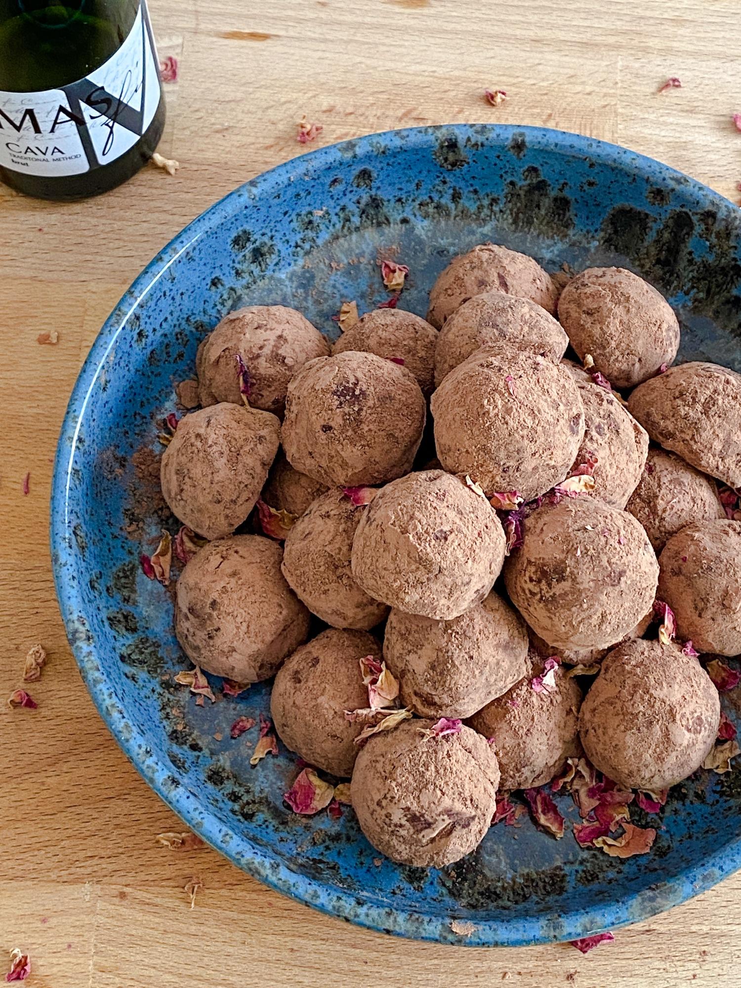 champagne and rose water truffles elegantly arranged on a serving platter