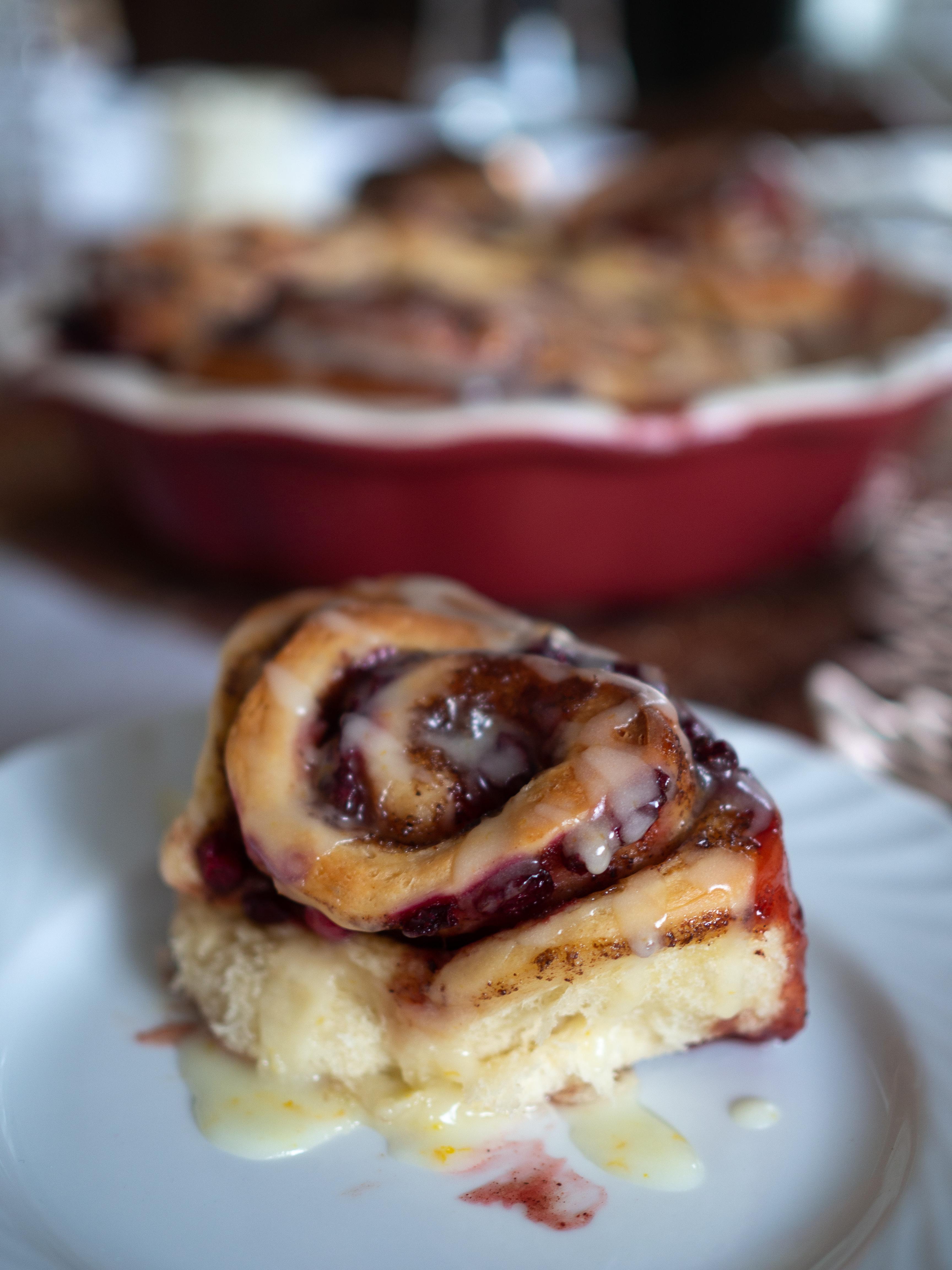 lingonberry and cinnamon filling being spread on dough