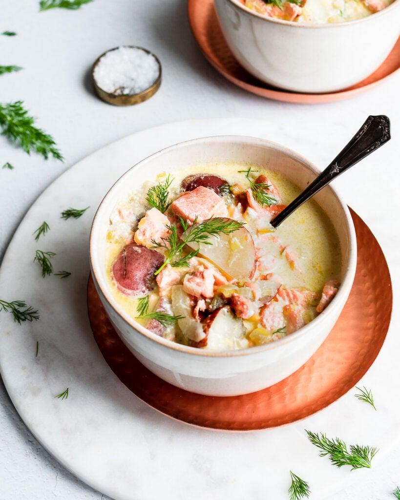 bowl of creamy smoked salmon chowder garnished with fresh dill