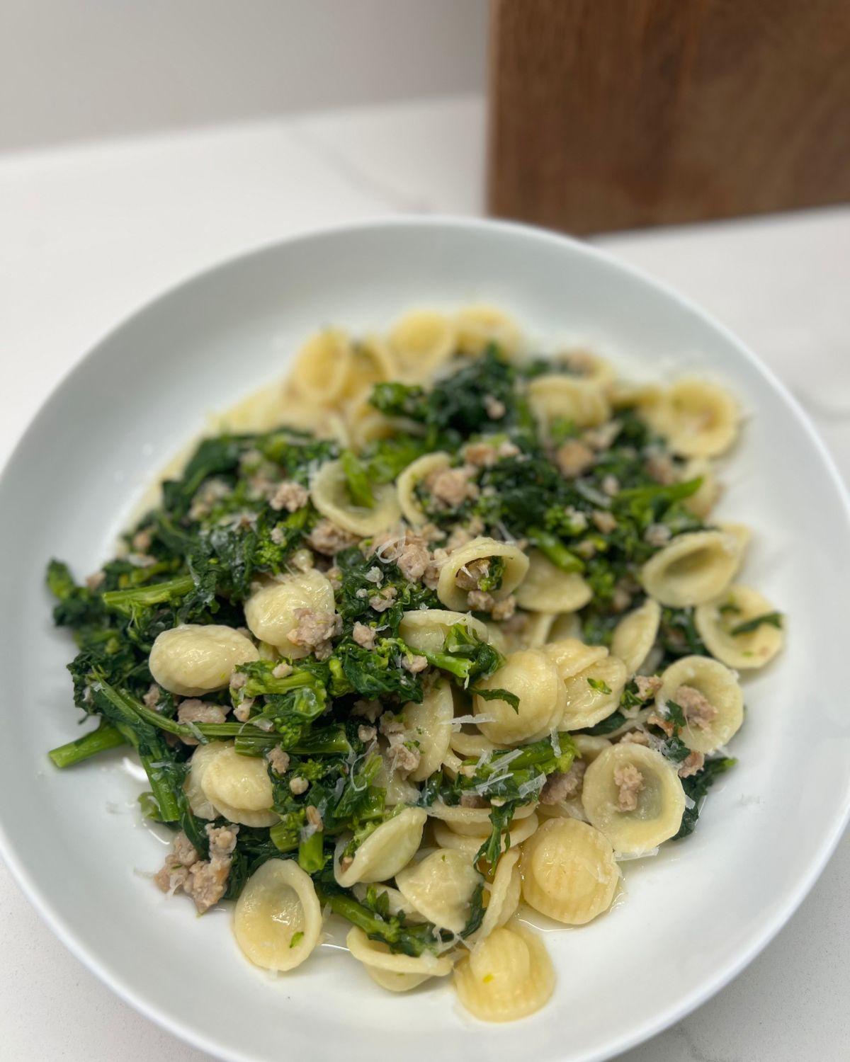 close-up shot of spicy sausage and broccoli rabe gluten-free pasta in a bowl
