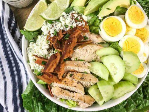 Bulgarian woman preparing keto avocado and yogurt salad in a rustic kitchen