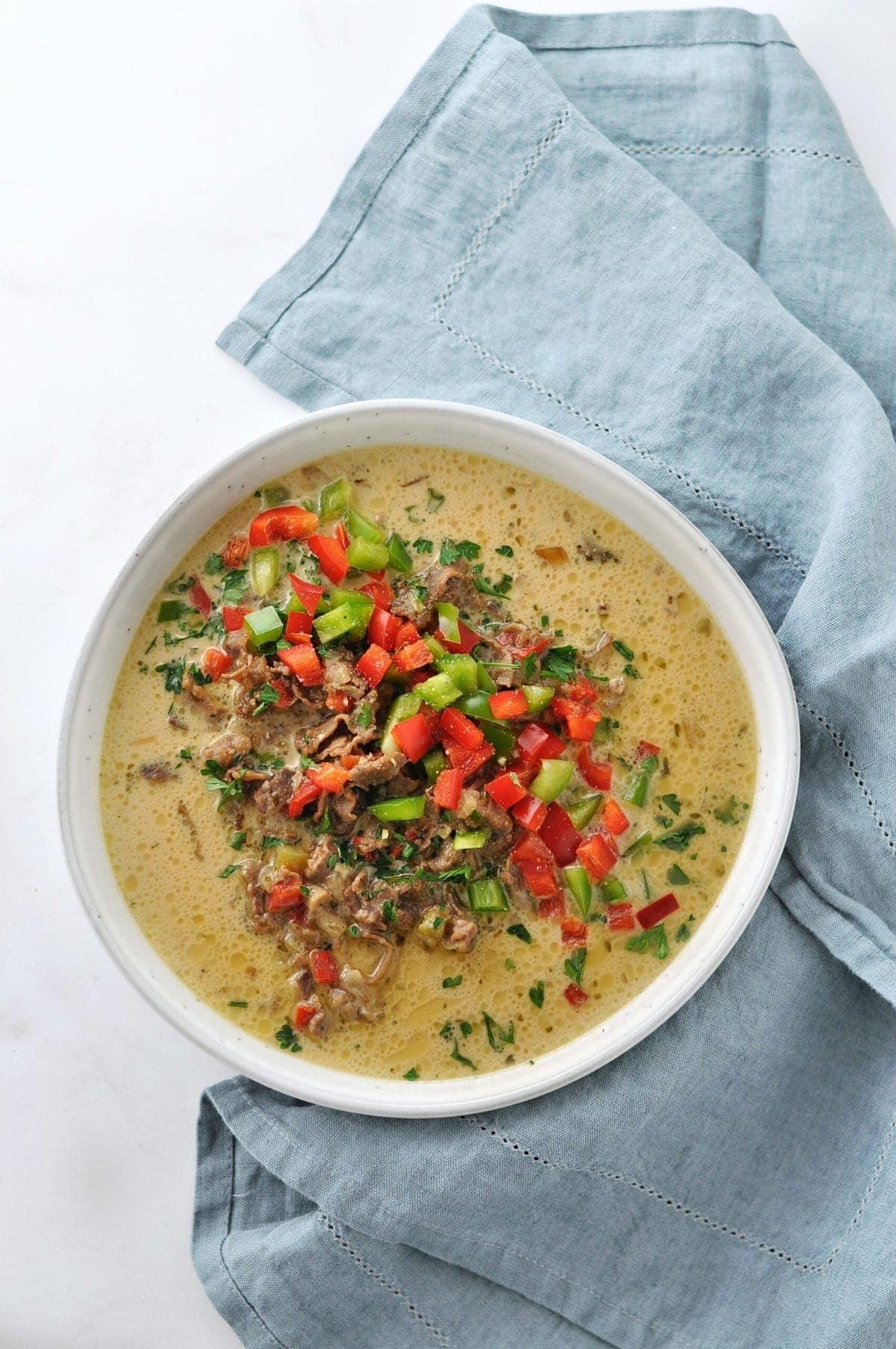 Ingredients for Keto Philly Cheesesteak Soup laid out on a kitchen counter