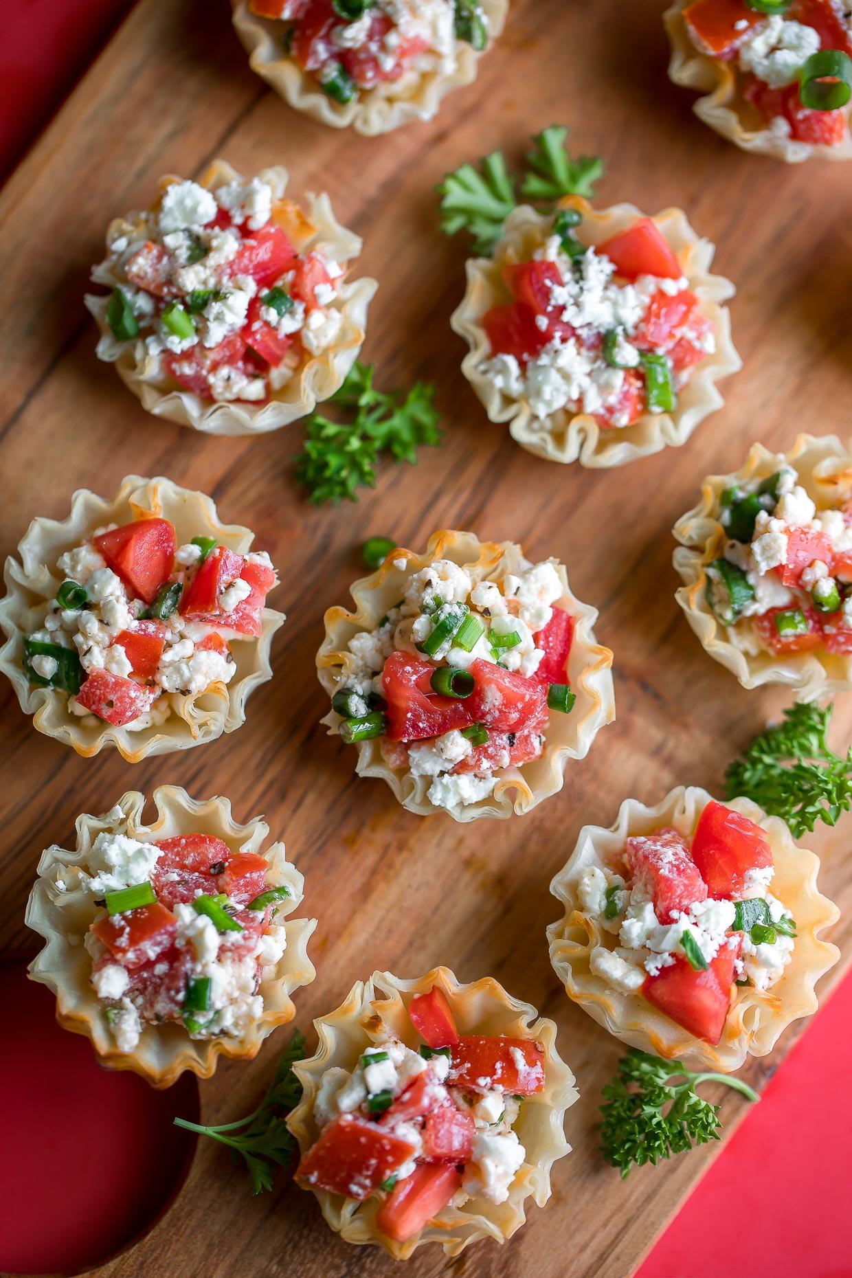 Close up of a single phyllo cup filled with falafel and feta