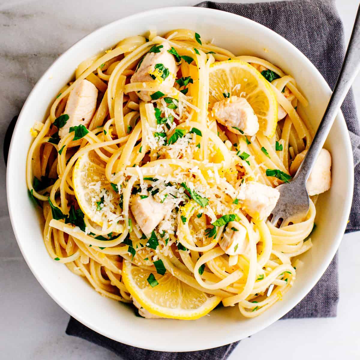 a bowl of lemon garlic chicken gluten-free pasta with fresh parsley