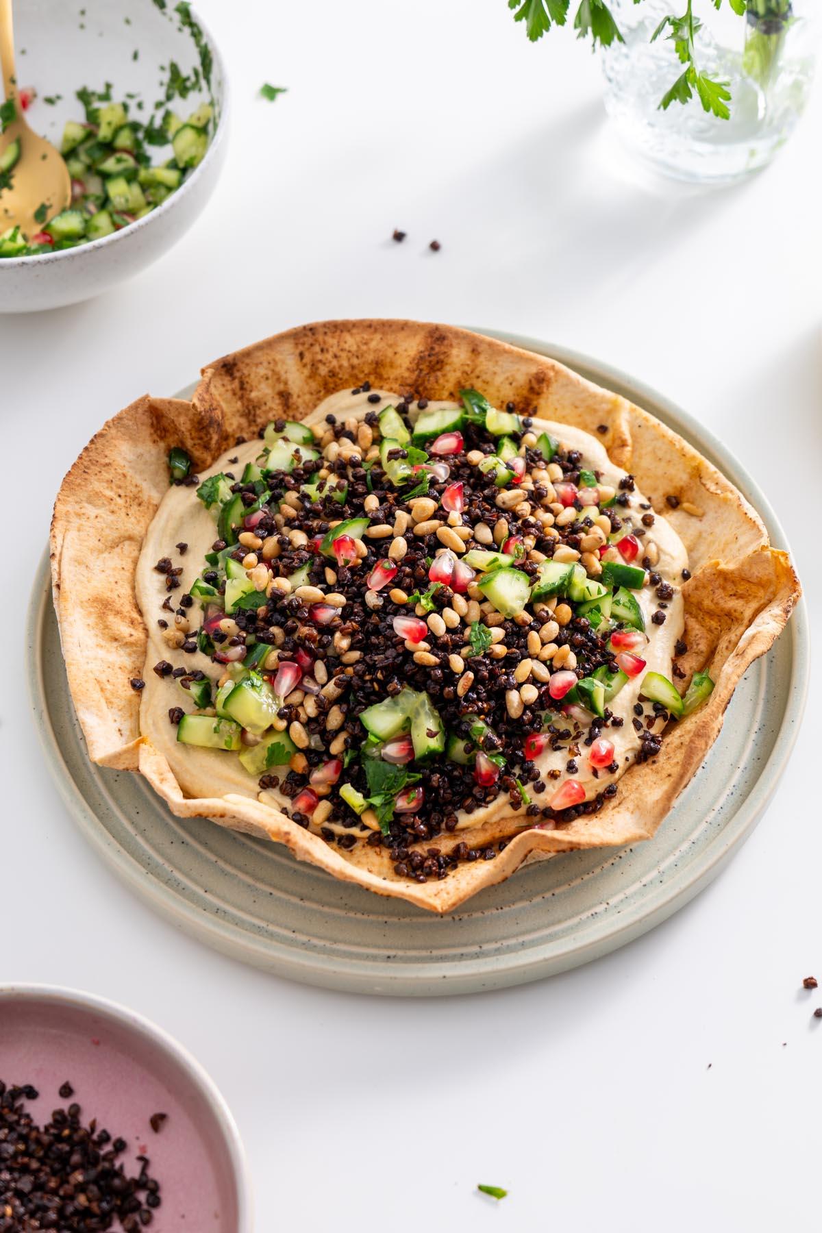 Bobotie Hummus Bowl served with pita bread