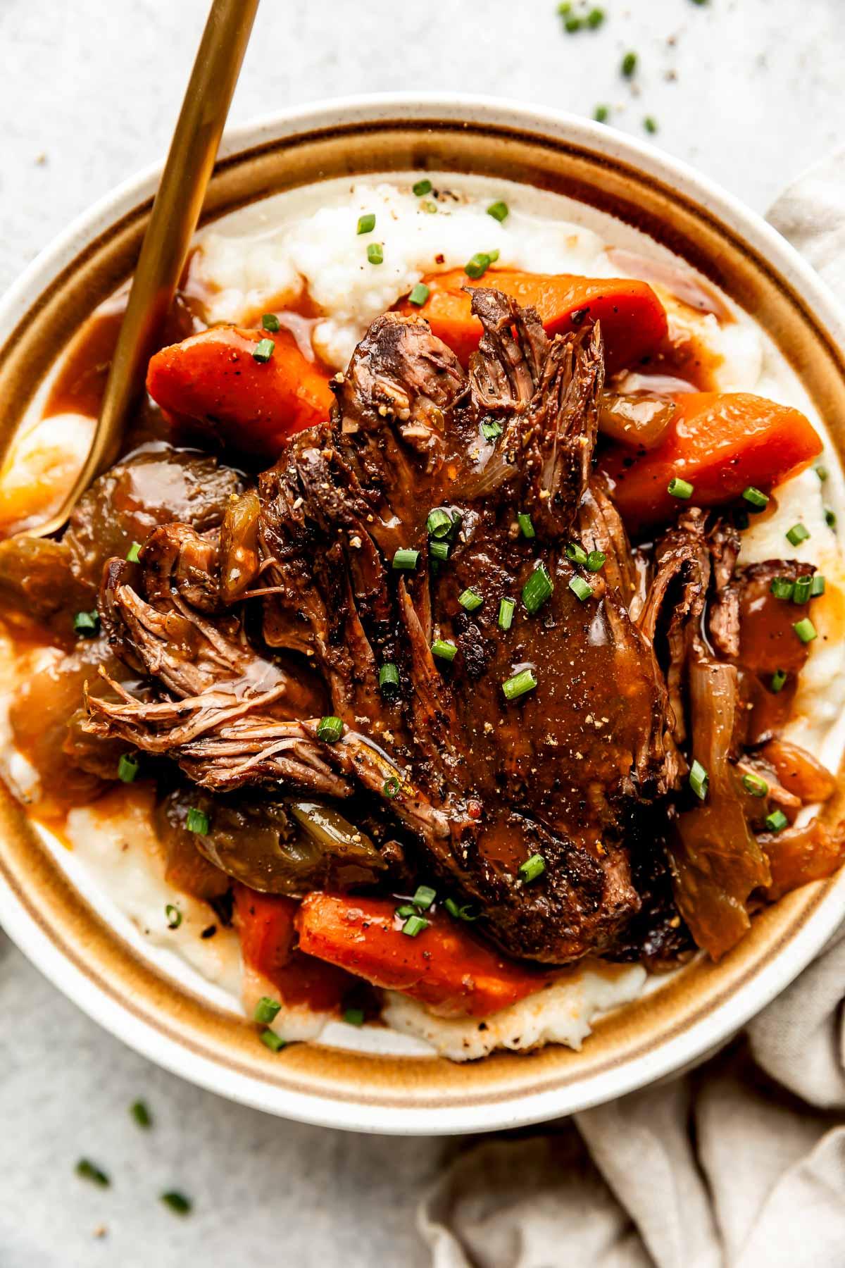 close up of a slow roasted beef with red wine sauce