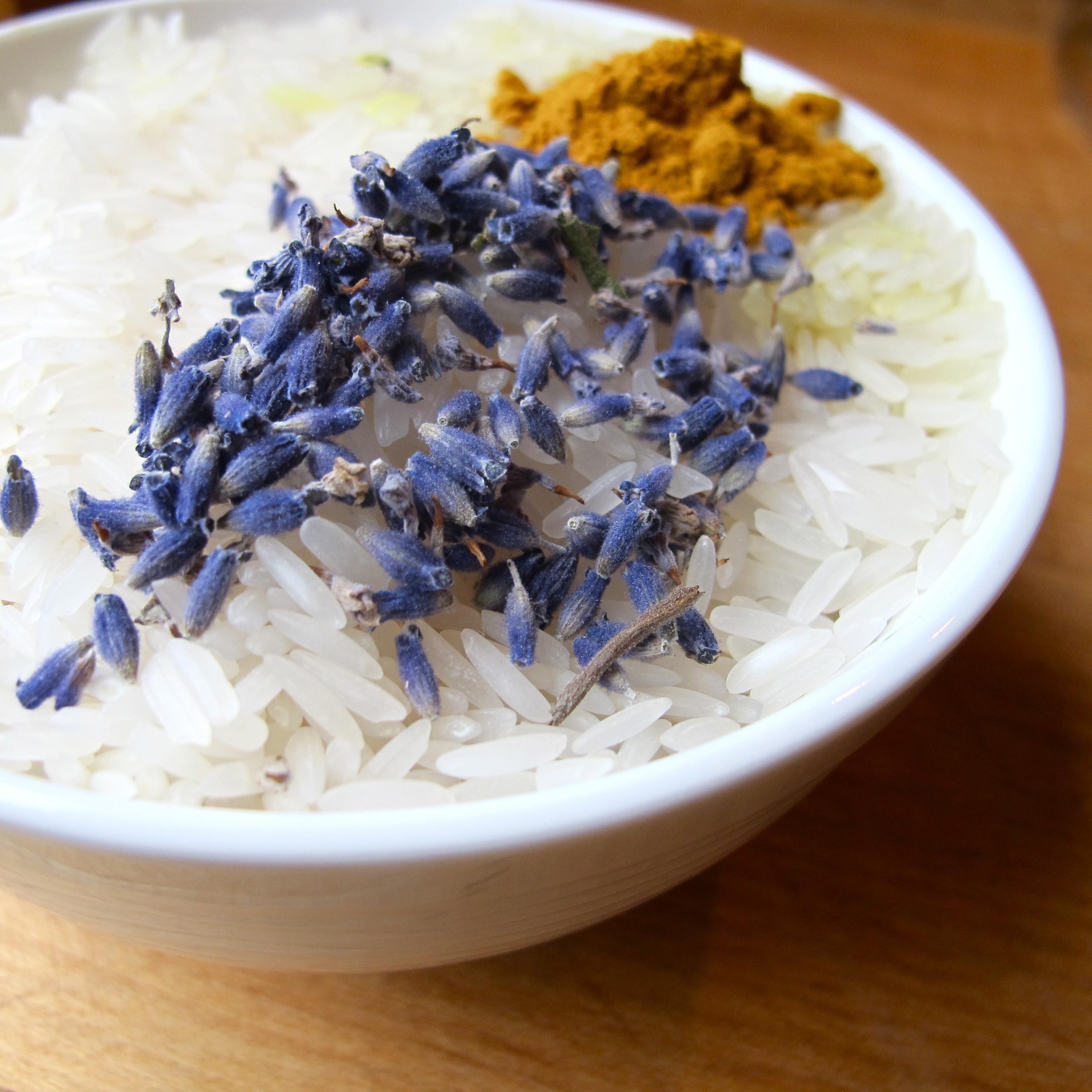 close up of lavender buds and honey drizzled on steamed rice