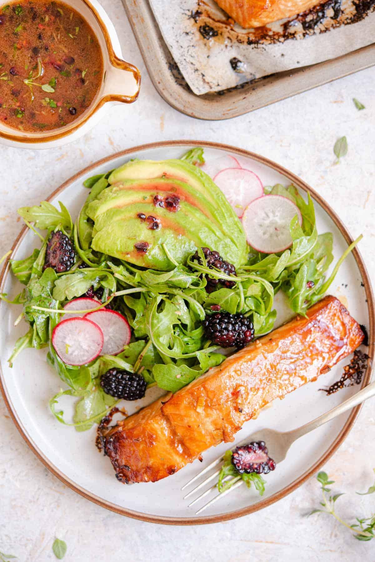 overhead shot of champagne glazed salmon served on a white plate