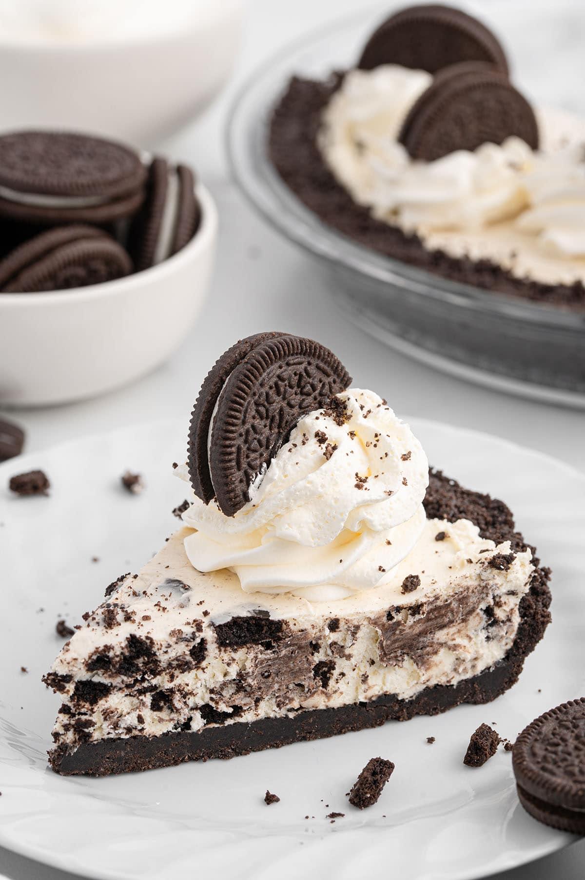 A group of people enjoying slices of Oreo tart