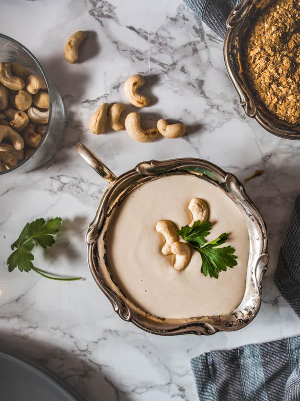 Close-up shot of creamy cashew cheese and vibrant mint sauce