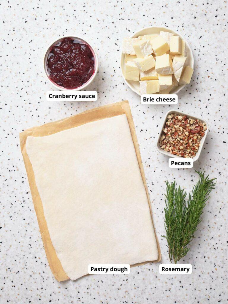 the ingredients for the cranberry brie ramen burger laid out on a kitchen counter