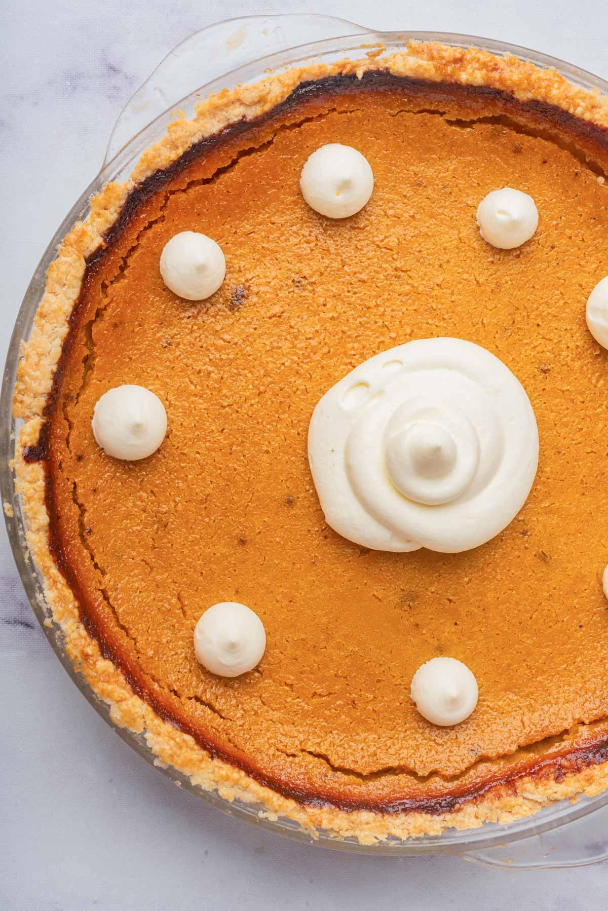 close-up shot of the interior of a soft vanilla pumpkin pie revealing its creamy texture