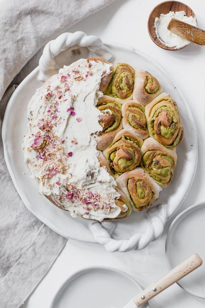 Rosewater and cardamom falooda spring rolls arranged on a decorative plate with rose petals
