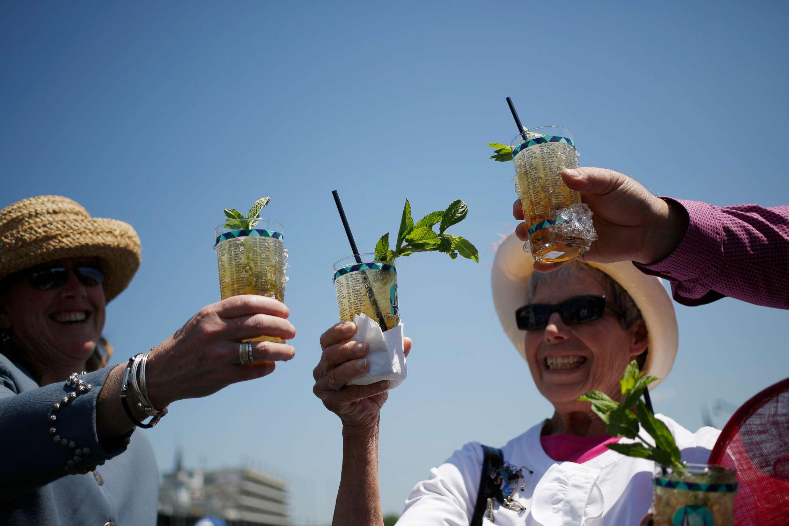 people enjoying mint julep wings at a party