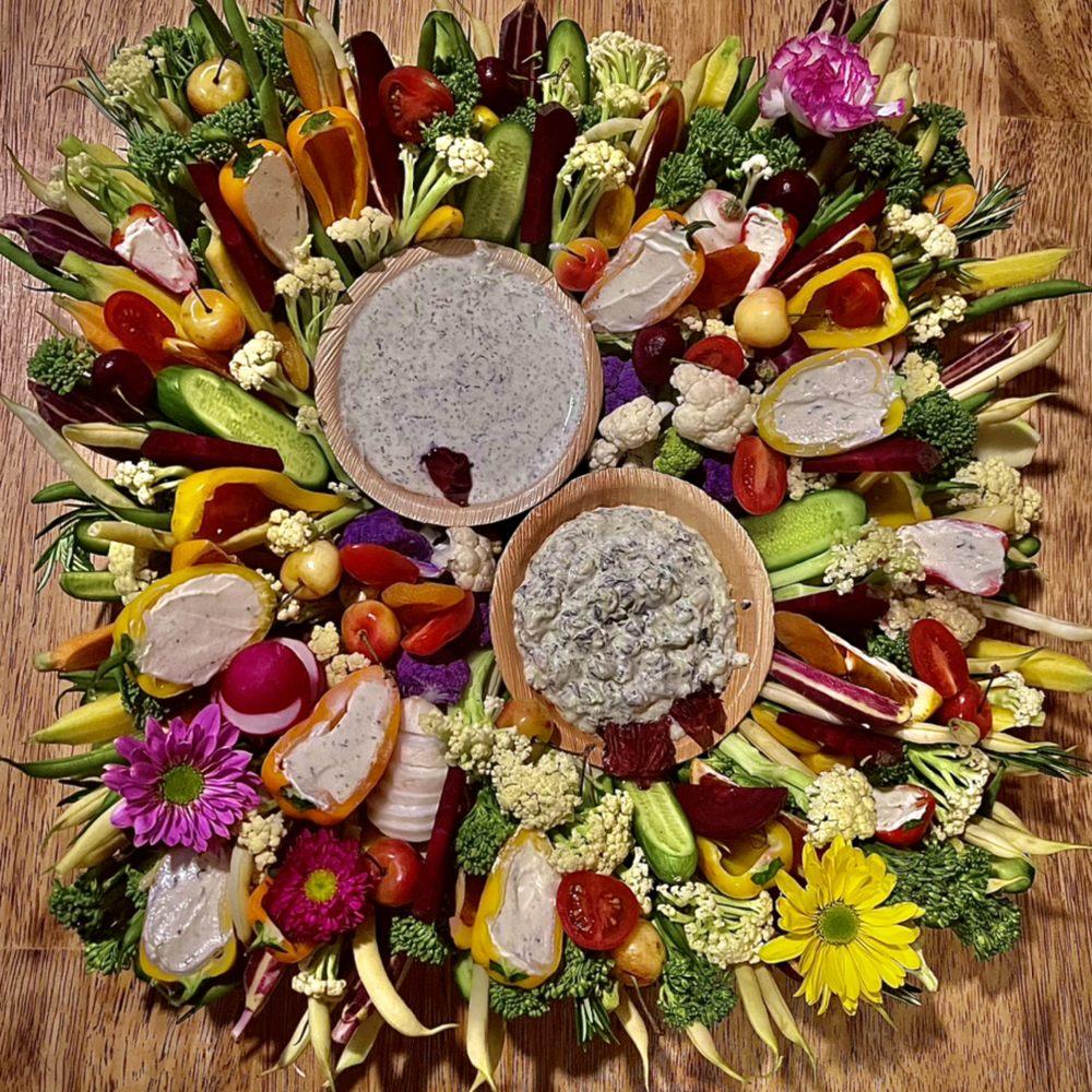 Overhead shot of several grilled corn and manchego empanadas arranged on a rustic wooden board