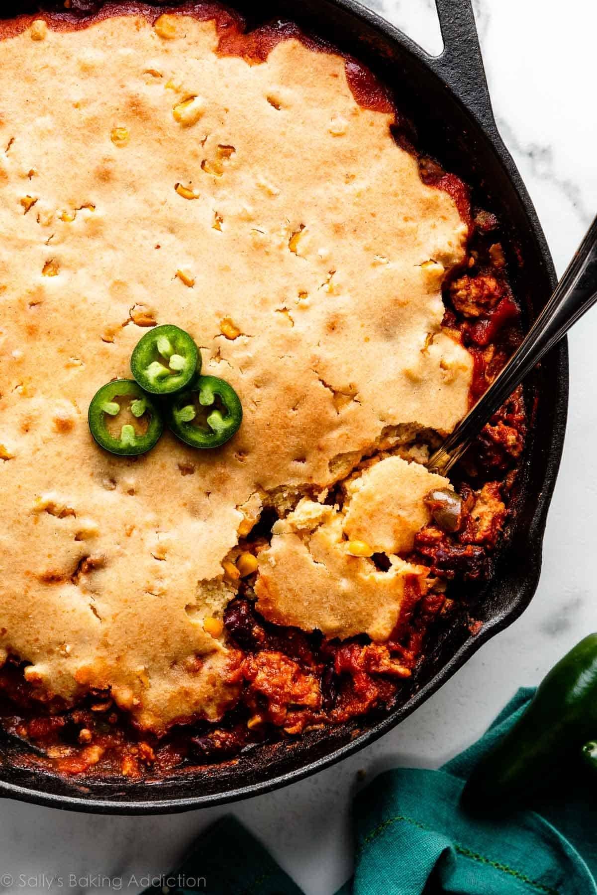 Chili served with cornbread and toppings