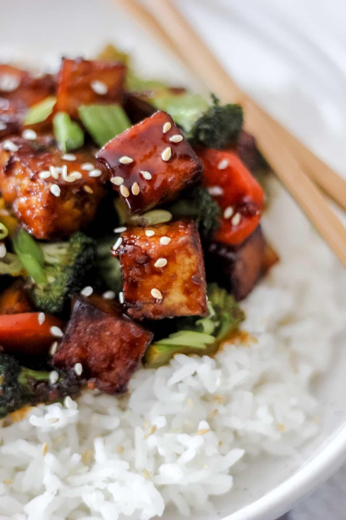 A bowl of perfectly cooked garlic butter tofu stir-fry, ready to be served