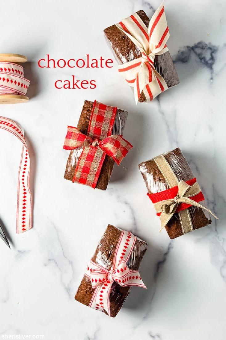 Beautifully wrapped chocolate loaf as a holiday gift with festive ribbon and a sprig of holly