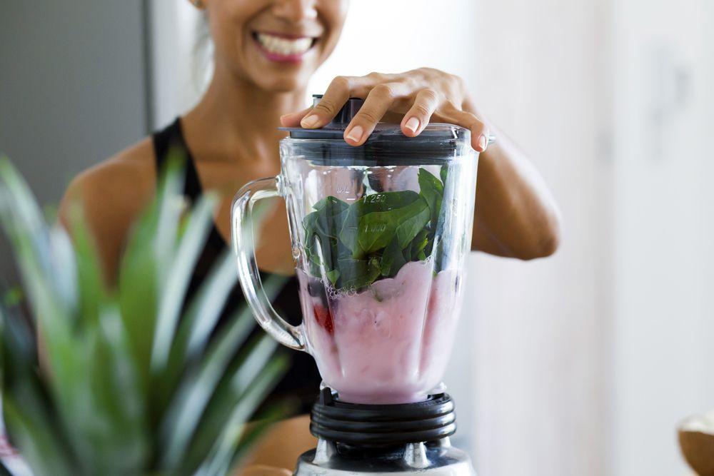 person blending a smoothie