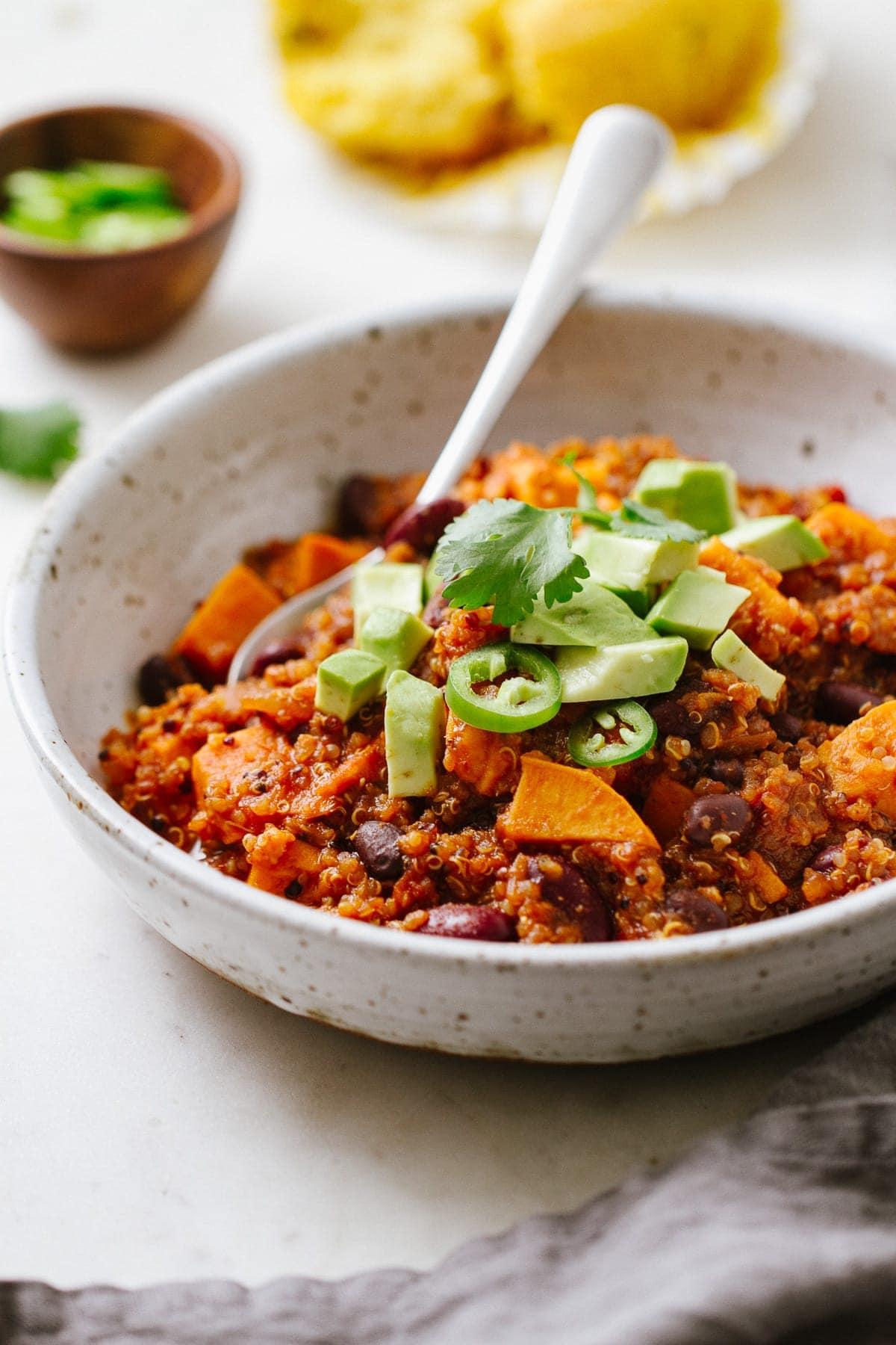 bowl of quinoa chili with sweet potatoes and corn