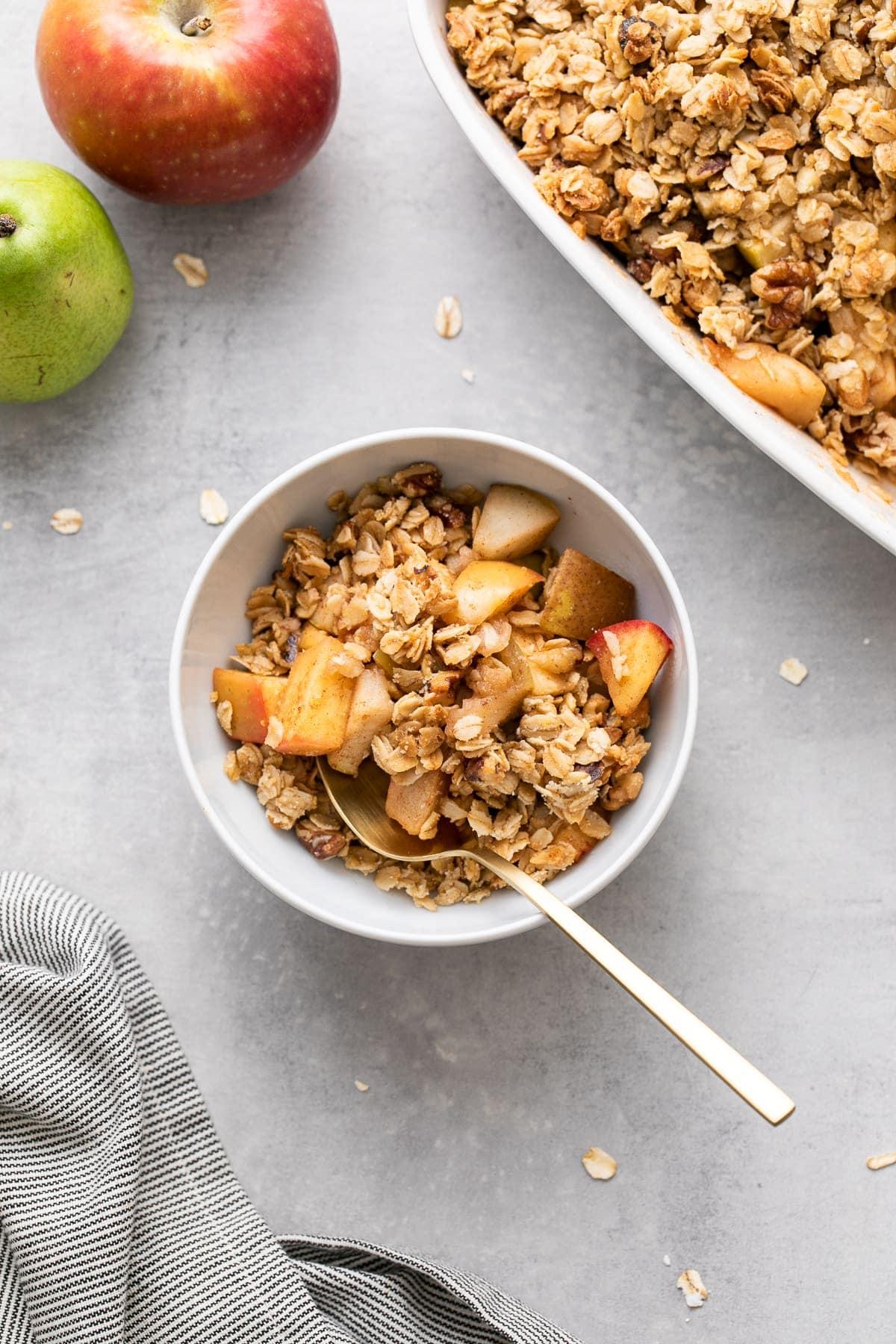 spiced apple and pear crisp in a rustic setting