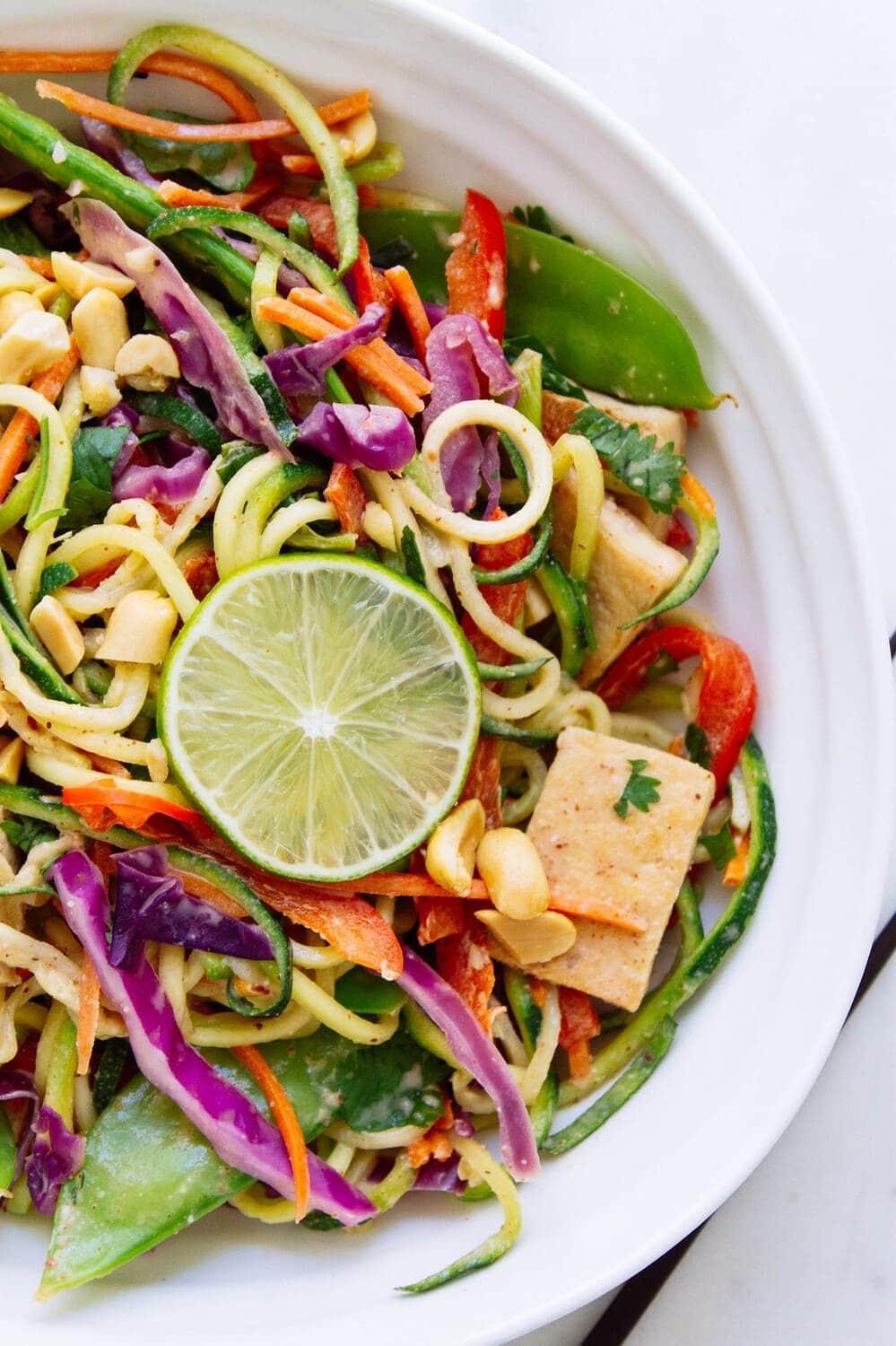 Spicy Peanut Zoodles with Tofu and Veggies in a bowl