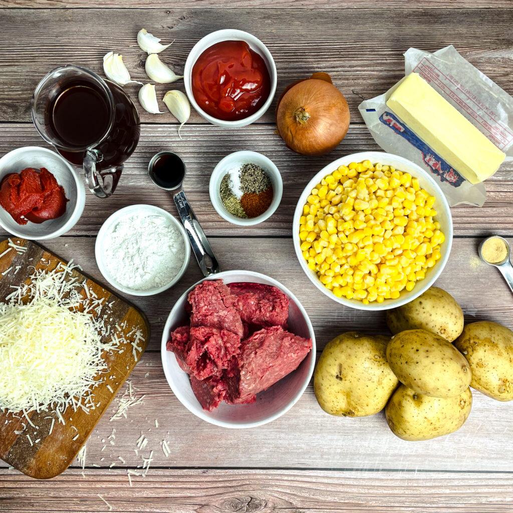 ingredients for shepherd's pie tacos laid out on a wooden surface
