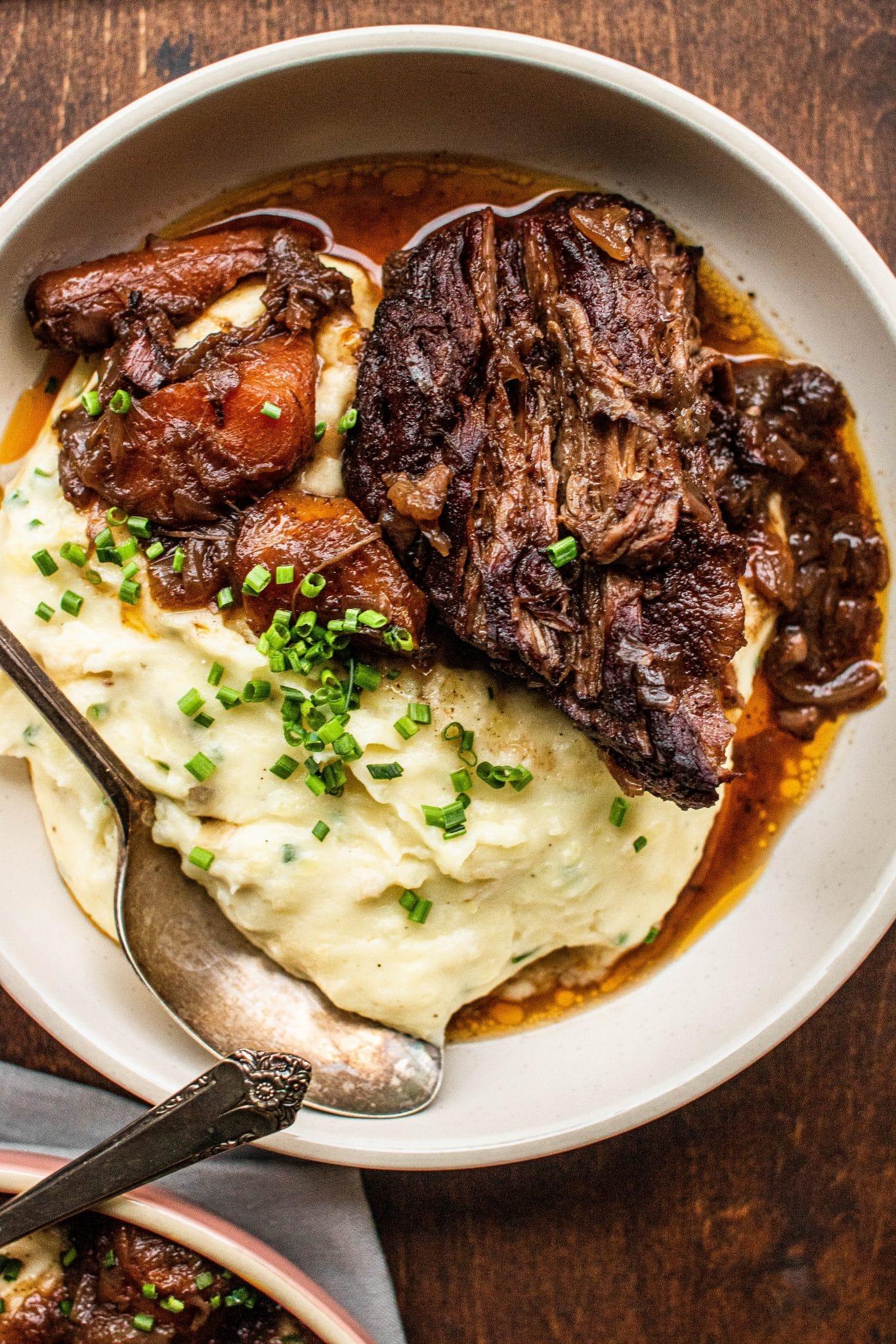 slow roasted beef with red wine sauce being sliced