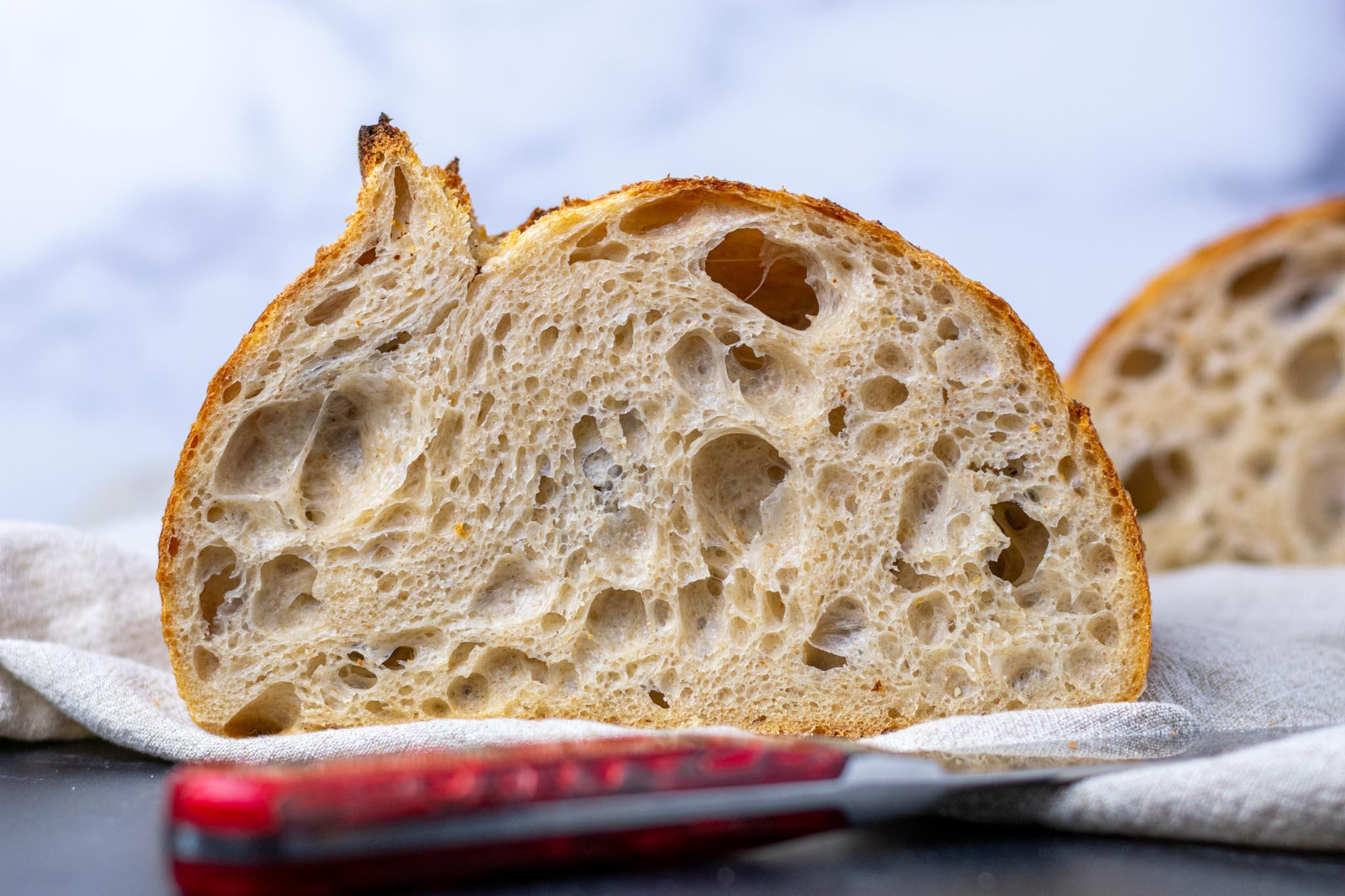 Sliced sourdough bread showing the airy crumb