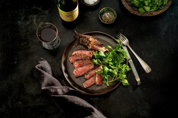 Steak with side dish and wine