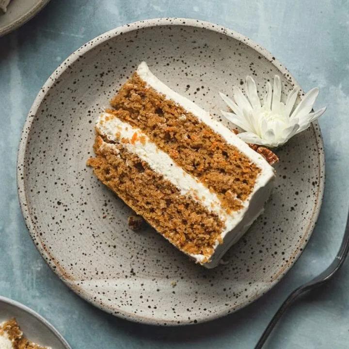 close up of keto carrot cake cheese crisps on a wooden cutting board