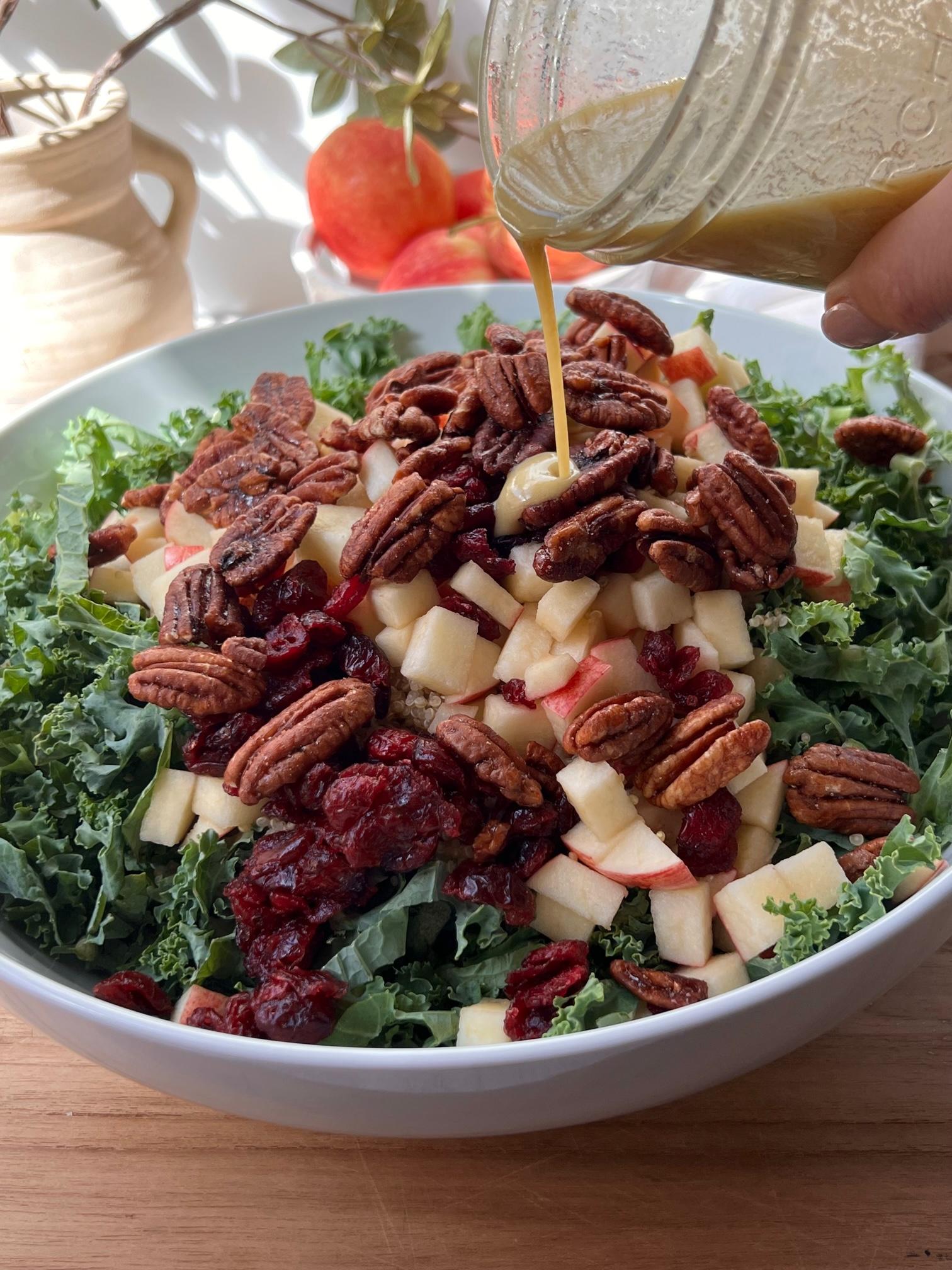 A vibrant bowl of Wheat Berry and Kale Salad with Maple-Dijon Dressing, garnished with toasted pecans