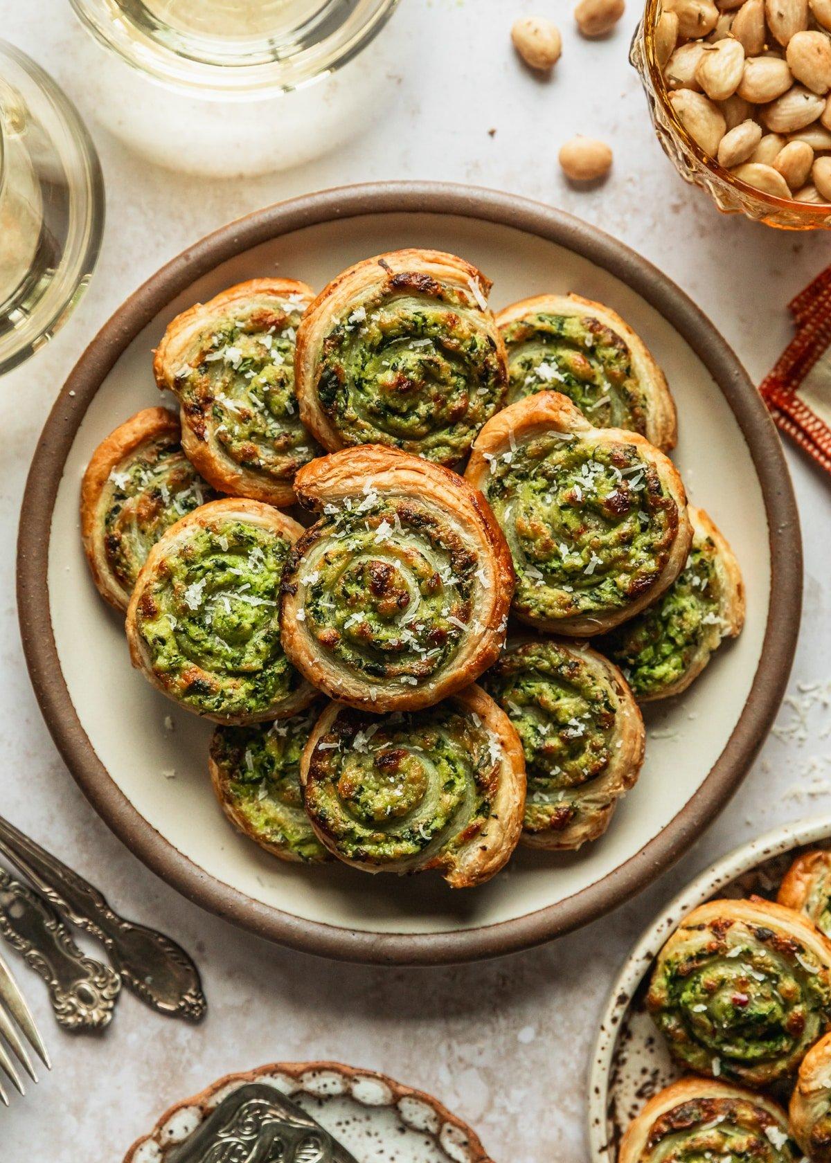 several spinach and ricotta sliders on a plate being served