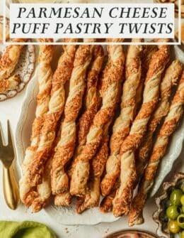 Close-up of a hand sprinkling grated Parmesan cheese over puff pastry strips