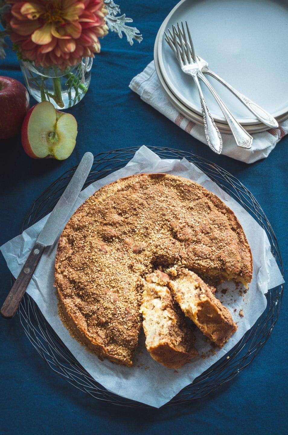 overhead shot of a cinnamon apple cake being prepared in a kitchen