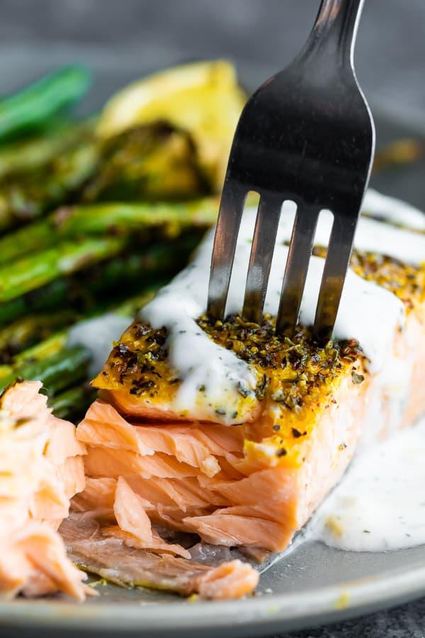 close up of lemon pepper salmon on a sheet pan