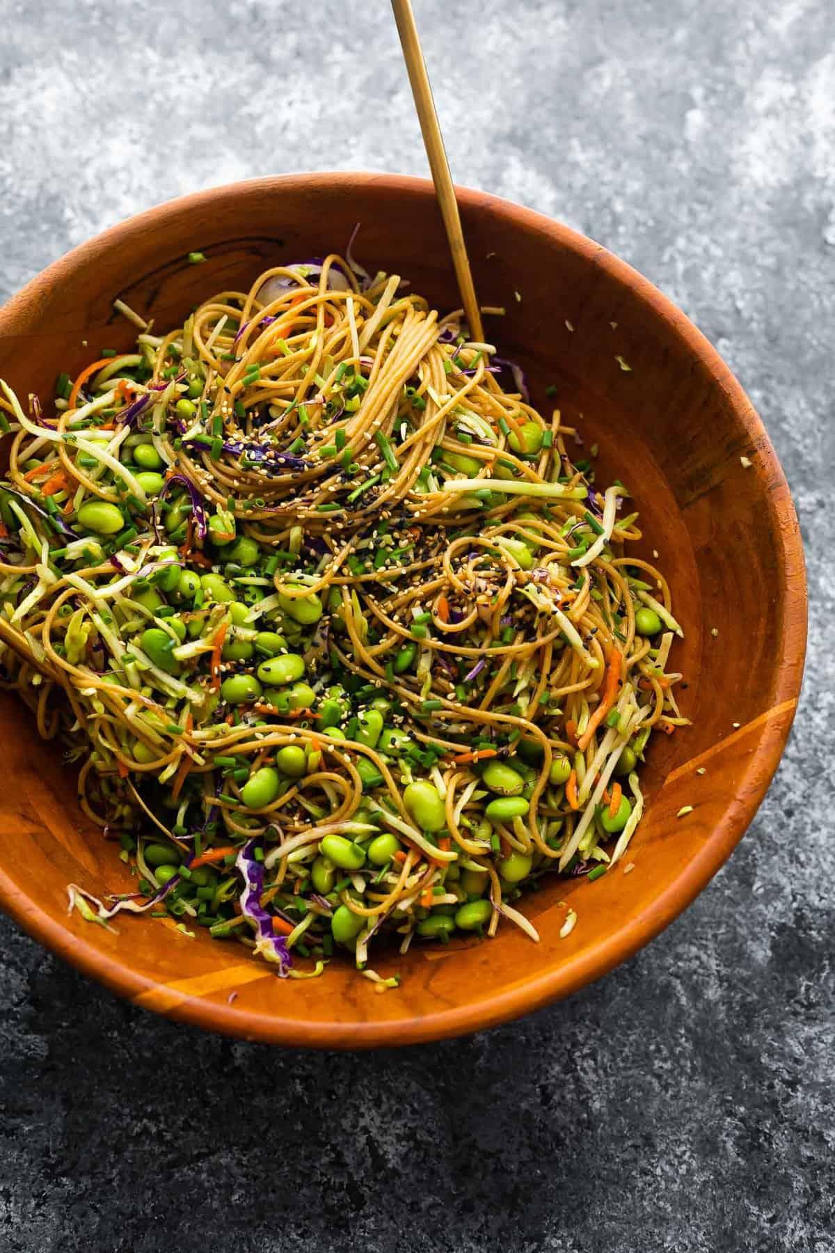 close up shot of asian sesame noodle salad with edamame