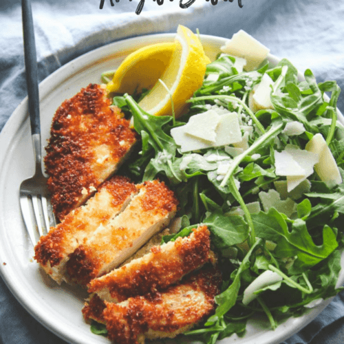 golden crispy fried chicken with parmesan and arugula salad
